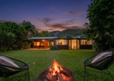 Professional day-to-dusk conversion of a New Zealand home with warm lighting.