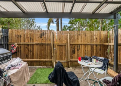Cluttered outdoor area before professional real estate photo item removal services in the Australia.