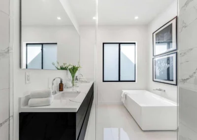 Modern luxury bathroom with HDR blending, showcasing a marble vanity and perfectly balanced interior lighting.