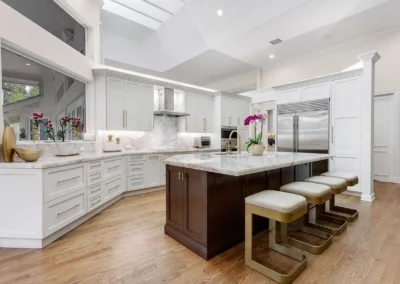 Professionally edited bright white marble kitchen, enhanced for luxury real estate listing photos.