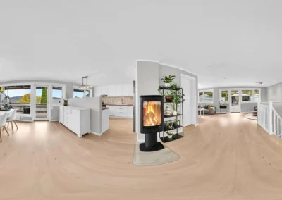 Professional 360 interior panorama of a modern living room and kitchen, featuring seamless stitching.