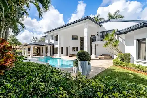Bright, color-corrected bedroom featuring manual HDR blending and clear window views.