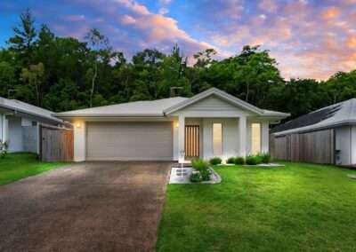 Professional day-to-dusk real estate photo editing showing a residential house with a stunning twilight sunset sky.