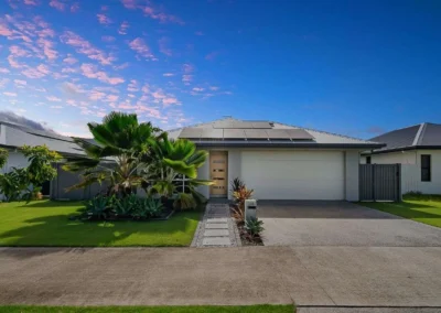 A modern home exterior featuring a vibrant dusk sky enhancement for professional real estate marketing.